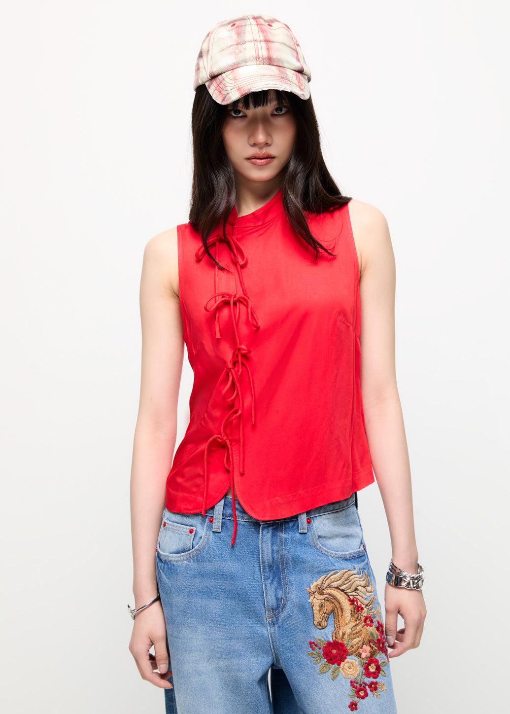 SLEEVELESS HIGH-NECK TOP WITH SIDE BOW CLOSURES