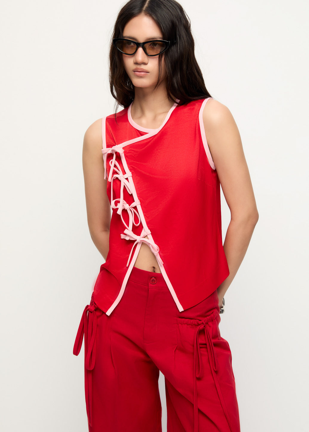STATEMENT BOW FRONT SLEEVELESS TOP