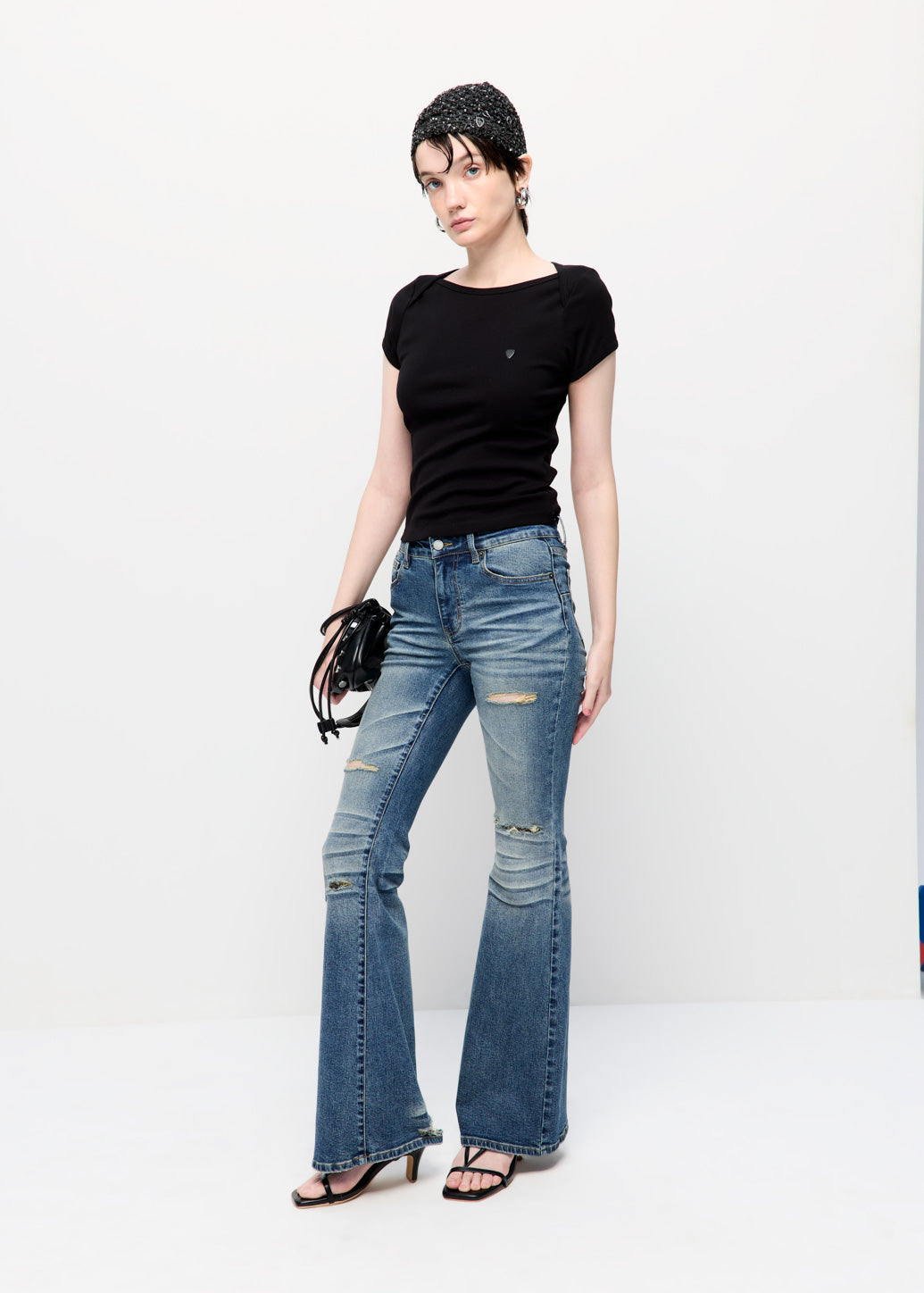 LOW-RISE DISTRESSED FLARE JEANS