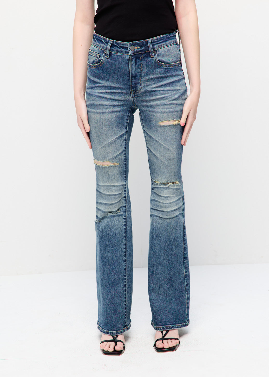 LOW-RISE DISTRESSED FLARE JEANS